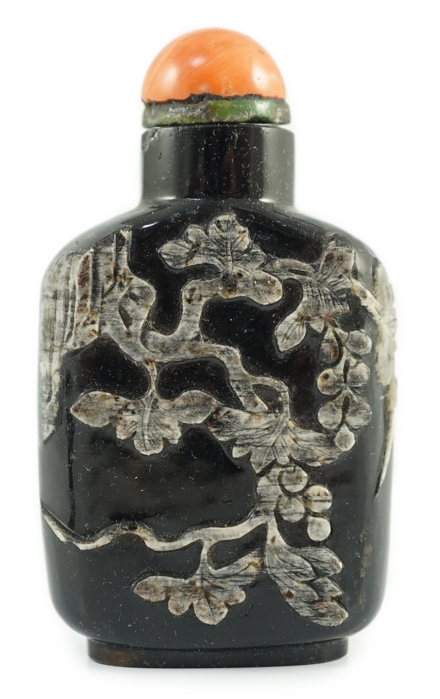 A Chinese smoky quartz snuff bottle, 1780-1820, 6.7cm high, coral stopper